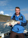 The author with a fat winter bass