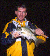 Fitzy with a lake bass caught while raining